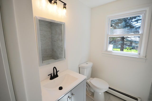 335 Wiklund Ave, Stratford, CT 06614 - half bath with a baseboard radiator, vanity, and tile patterned floors