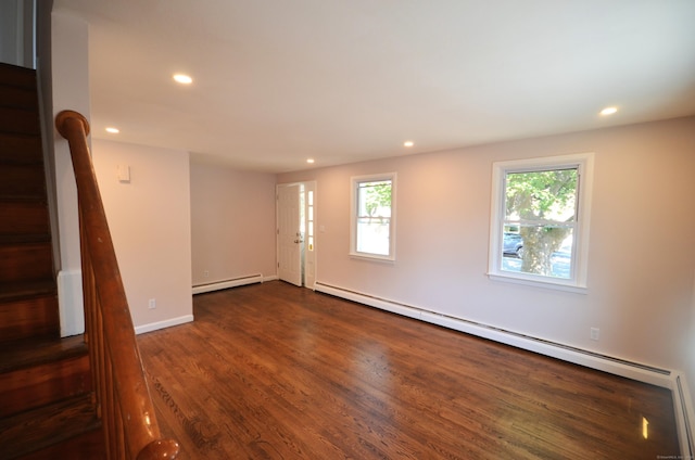 335 Wiklund Ave, Stratford, CT 06614 - empty room with a baseboard heating unit, a baseboard radiator, recessed lighting, stairway, and dark wood finished floors