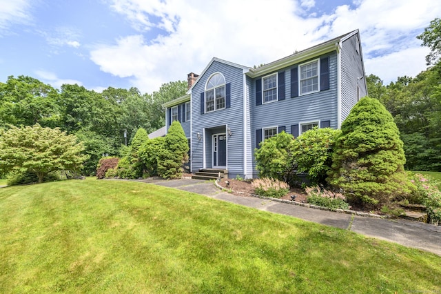 491 Hammertown Rd, Monroe, CT 06468 - colonial-style house with a chimney and a front lawn