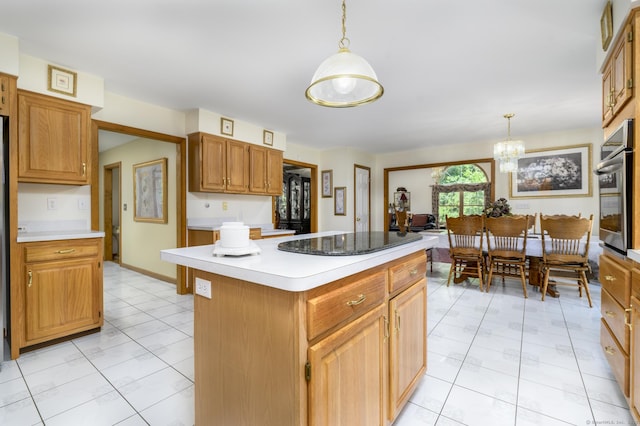 491 Hammertown Rd, Monroe, CT 06468 - kitchen featuring stainless steel oven, a kitchen island, hanging light fixtures, a chandelier, and light countertops
