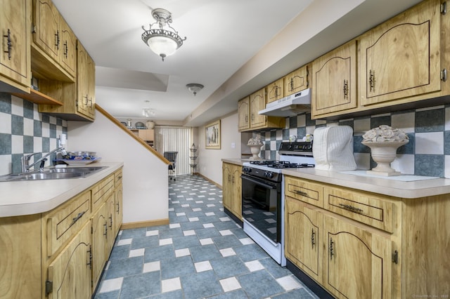 491 Hammertown Rd, Monroe, CT 06468 - kitchen with range with gas cooktop, under cabinet range hood, light countertops, dark flooring, and decorative backsplash