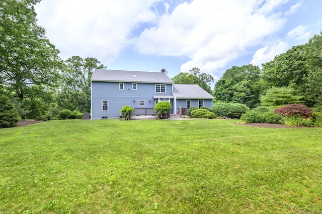 491 Hammertown Rd, Monroe, CT 06468 - rear view of house featuring a yard, a chimney, and a deck
