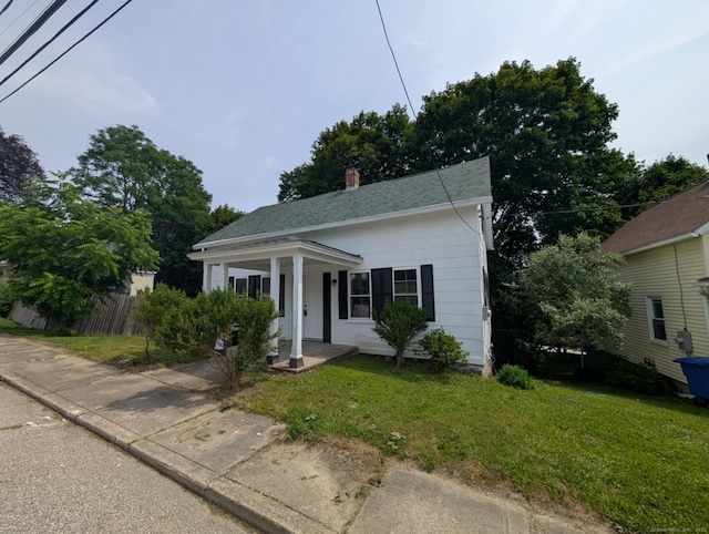 18 Highland St, Plainfield, CT 06354 - view of front of house featuring a chimney and a shingled roof