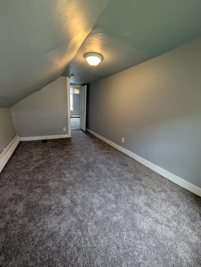 18 Highland St, Plainfield, CT 06354 - additional living space with vaulted ceiling, dark carpet, and baseboard heating