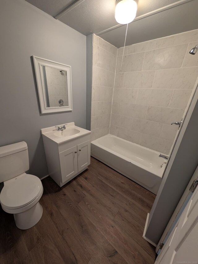 18 Highland St, Plainfield, CT 06354 - bathroom with vanity, wood finished floors, and bathing tub / shower combination