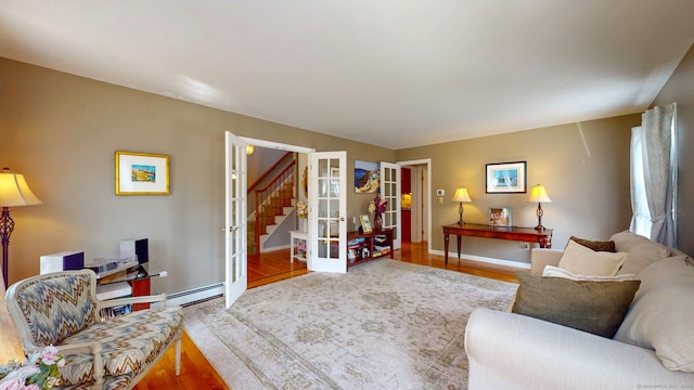 803 Grassy Hill Rd, Orange, CT 06477 - living room with french doors, wood finished floors, stairs, and a baseboard heating unit