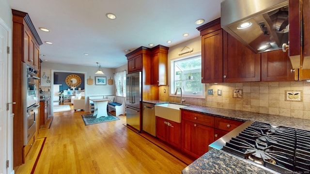 803 Grassy Hill Rd, Orange, CT 06477 - kitchen featuring extractor fan, stainless steel appliances, light wood-style floors, backsplash, and recessed lighting