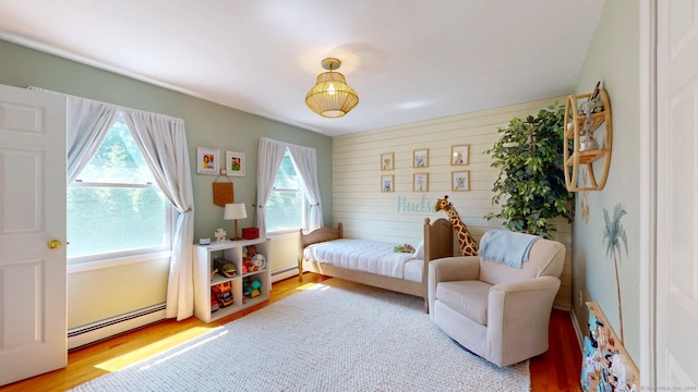 803 Grassy Hill Rd, Orange, CT 06477 - bedroom featuring baseboard heating and wood finished floors