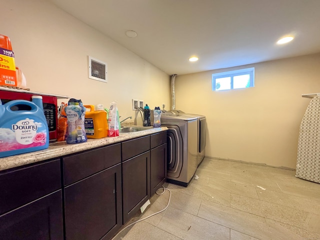 1589 Main St, East Hartford, CT 06108 - washroom with washing machine and clothes dryer, recessed lighting, and cabinet space