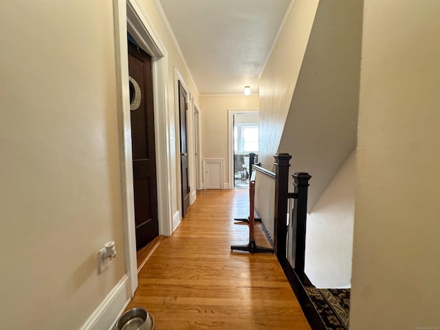 1589 Main St, East Hartford, CT 06108 - hallway featuring an upstairs landing, crown molding, and wood finished floors