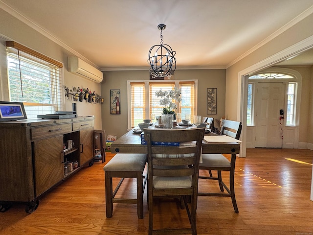 1589 Main St, East Hartford, CT 06108 - dining space with a wall mounted air conditioner, light wood finished floors, healthy amount of natural light, a chandelier, and crown molding