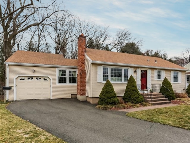 53 Lydall Rd, East Hartford, CT 06118 - ranch-style home featuring an attached garage, a chimney, and asphalt driveway