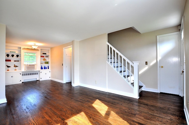 47 Westwood Dr, Simsbury, CT 06070 - unfurnished living room featuring radiator, wood finished floors, stairway, and built in features