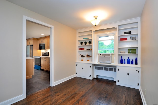 47 Westwood Dr, Simsbury, CT 06070 - home office with radiator heating unit, cooling unit, dark wood-style flooring, and built in desk