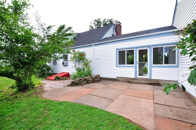 47 Westwood Dr, Simsbury, CT 06070 - rear view of house with a chimney, a patio, and roof with shingles