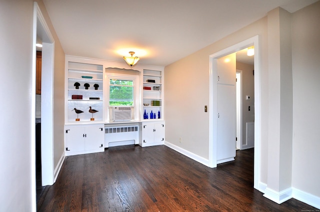 47 Westwood Dr, Simsbury, CT 06070 - unfurnished living room featuring radiator, dark wood finished floors, built in shelves, and cooling unit