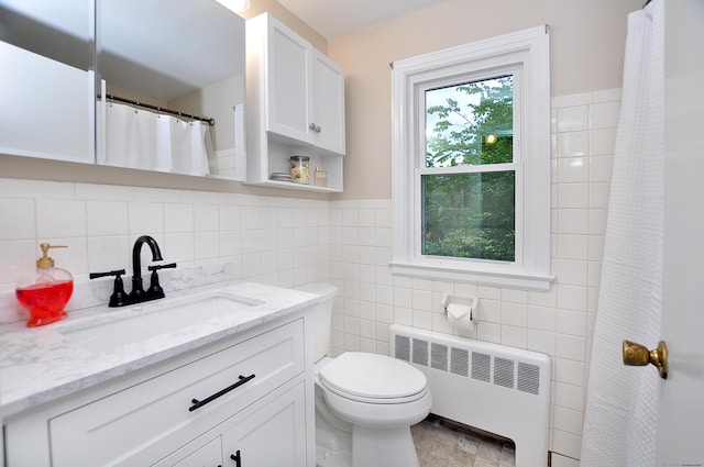 47 Westwood Dr, Simsbury, CT 06070 - bathroom with radiator, vanity, tile walls, and a shower with curtain