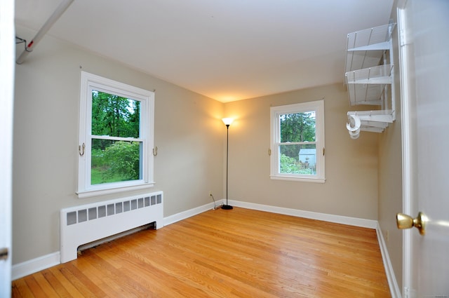 47 Westwood Dr, Simsbury, CT 06070 - unfurnished room with radiator heating unit and light wood finished floors