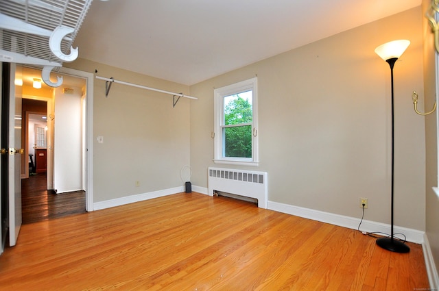 47 Westwood Dr, Simsbury, CT 06070 - spare room with radiator and light wood finished floors