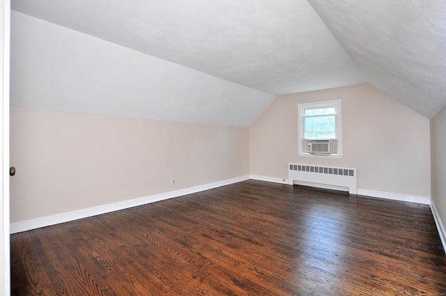 47 Westwood Dr, Simsbury, CT 06070 - bonus room with radiator, cooling unit, dark wood-style floors, and lofted ceiling