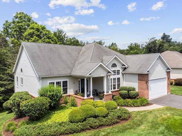 39 Emily Way Unit 39, West Hartford, CT 06107 - traditional-style house with brick siding, an attached garage, roof with shingles, and driveway