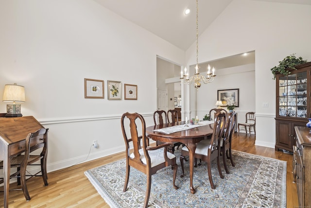 39 Emily Way Unit 39, West Hartford, CT 06107 - dining space with a chandelier, wood finished floors, and high vaulted ceiling