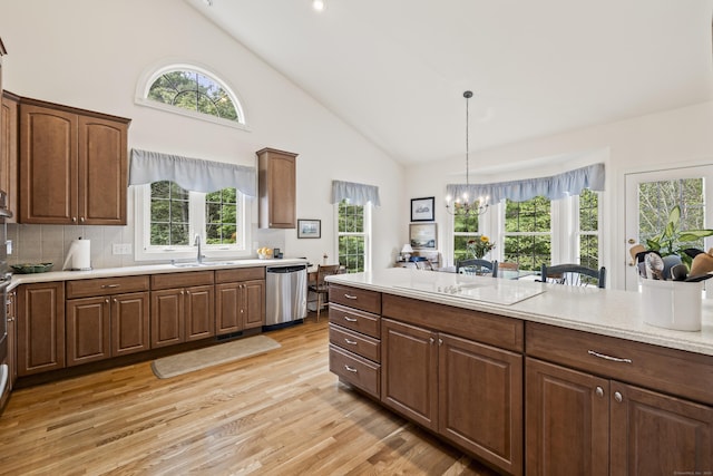 39 Emily Way Unit 39, West Hartford, CT 06107 - kitchen with dishwasher, electric cooktop, light wood-style floors, light countertops, and high vaulted ceiling