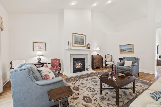 39 Emily Way Unit 39, West Hartford, CT 06107 - living area with wood finished floors, a glass covered fireplace, and high vaulted ceiling