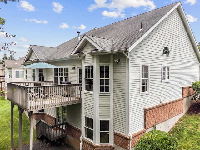 39 Emily Way Unit 39, West Hartford, CT 06107 - rear view of property with brick siding, a deck, and roof with shingles