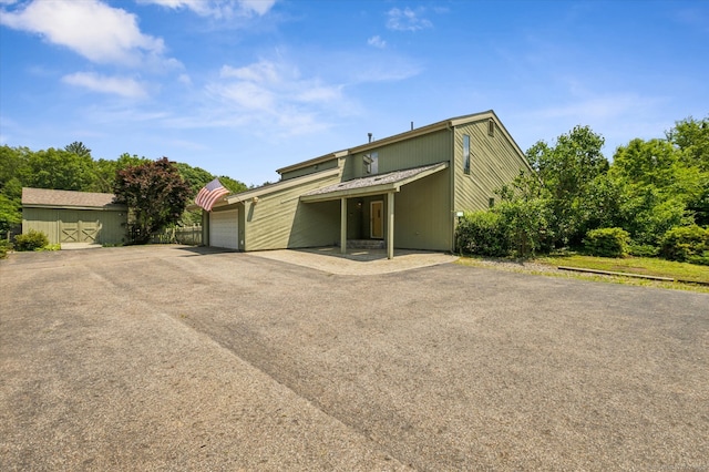 80 Tuckie Rd, Windham, CT 06280 - view of front of home featuring an attached garage and asphalt driveway