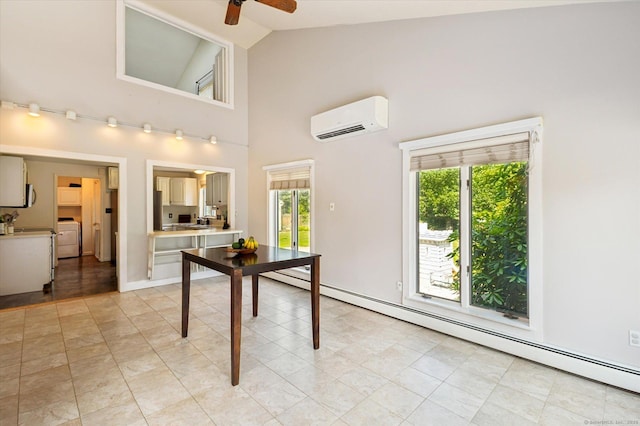 80 Tuckie Rd, Windham, CT 06280 - dining area with a wall unit AC, healthy amount of natural light, a ceiling fan, washer / dryer, and high vaulted ceiling
