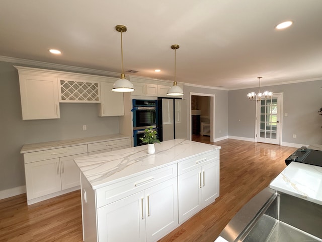2125 Shepard Ave, Hamden, CT 06518 - kitchen featuring double oven, a chandelier, a center island, light wood-style floors, and crown molding