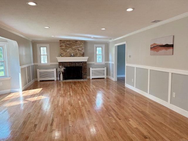 2125 Shepard Ave, Hamden, CT 06518 - unfurnished living room with radiator heating unit, ornamental molding, light wood finished floors, a fireplace, and recessed lighting