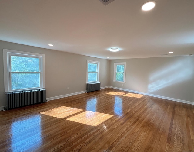 2125 Shepard Ave, Hamden, CT 06518 - unfurnished room with radiator heating unit, wood finished floors, and recessed lighting