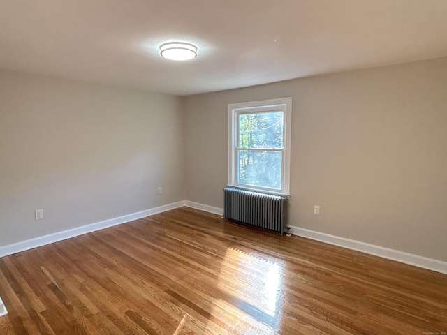 2125 Shepard Ave, Hamden, CT 06518 - spare room with radiator heating unit and wood finished floors