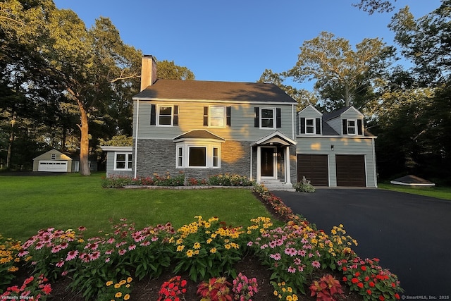 2125 Shepard Ave, Hamden, CT 06518 - view of front of home featuring a chimney, stone siding, driveway, and a front lawn
