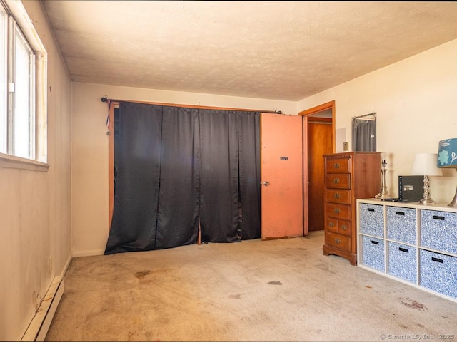 466 Middeltown Ave Unit 17, New Haven, CT 06513 - carpeted bedroom featuring a baseboard radiator