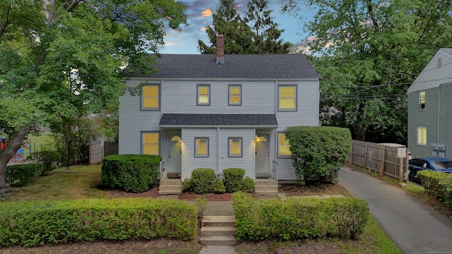 83 Woodlawn Cir E, Hartford, CT 06108 - townhome / multi-family property featuring a chimney and roof with shingles