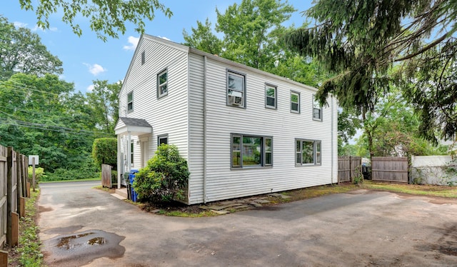 83 Woodlawn Cir E, Hartford, CT 06108 - view of side of home featuring a patio area