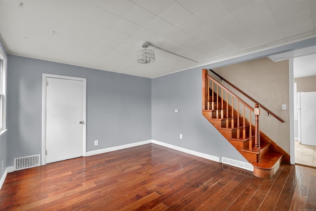 83 Woodlawn Cir E, Hartford, CT 06108 - unfurnished room featuring wood-type flooring and stairway