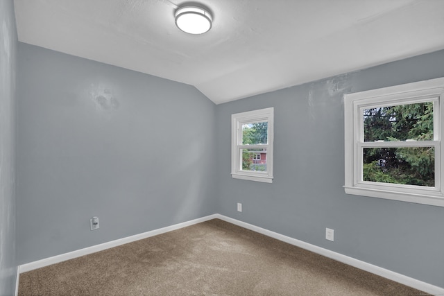83 Woodlawn Cir E, Hartford, CT 06108 - unfurnished room featuring lofted ceiling and carpet
