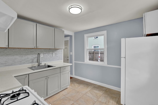 83 Woodlawn Cir E, Hartford, CT 06108 - kitchen with white appliances, decorative backsplash, light countertops, and light tile patterned floors