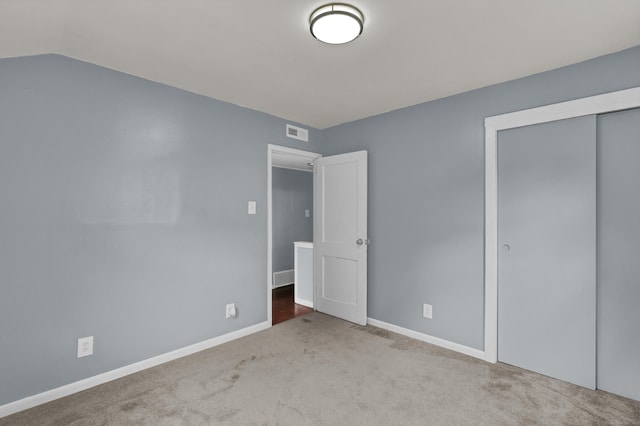83 Woodlawn Cir E, Hartford, CT 06108 - unfurnished bedroom featuring carpet flooring and a closet