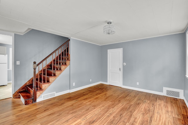 83 Woodlawn Cir E, Hartford, CT 06108 - unfurnished living room featuring stairway, wood finished floors, and ornamental molding