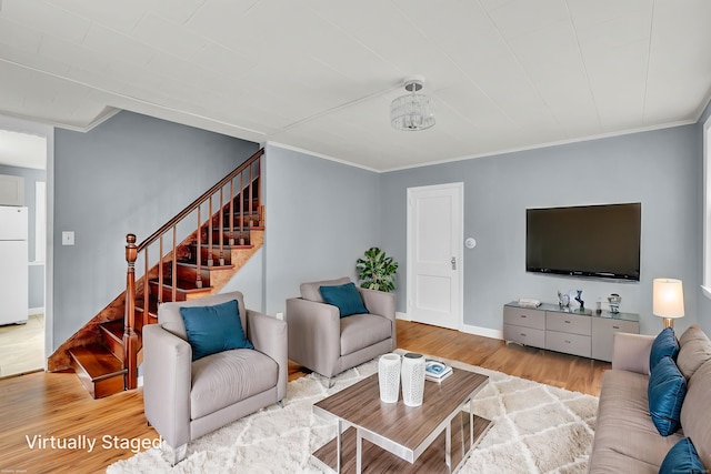 83 Woodlawn Cir E, Hartford, CT 06108 - living area featuring wood finished floors, stairs, and ornamental molding