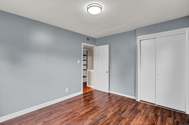 83 Woodlawn Cir E, Hartford, CT 06108 - unfurnished bedroom featuring wood finished floors and a closet