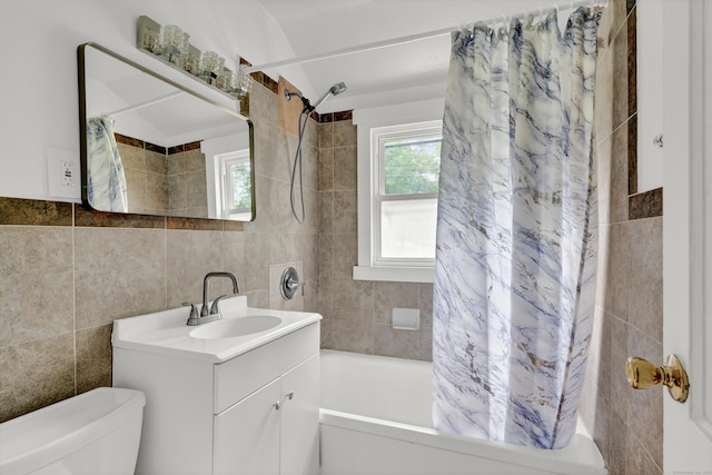 83 Woodlawn Cir E, Hartford, CT 06108 - bathroom featuring tile walls, shower / bath combo, vanity, and backsplash