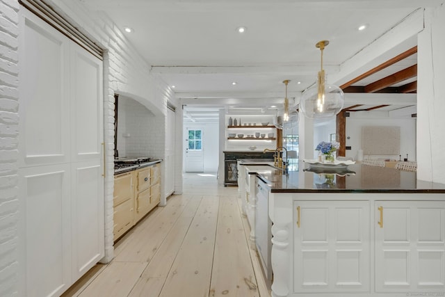 2024 Stratfield Rd, Fairfield, CT 06825 - kitchen featuring dark countertops, light wood-style flooring, hanging light fixtures, white cabinets, and recessed lighting