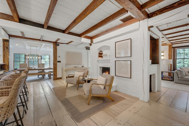 2024 Stratfield Rd, Fairfield, CT 06825 - living area featuring a brick fireplace, beamed ceiling, and light wood finished floors