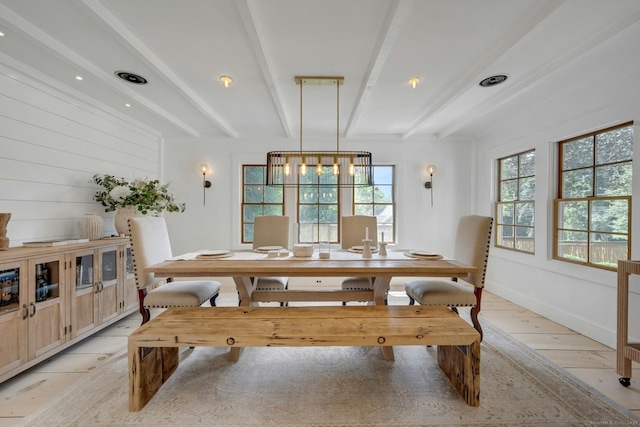 2024 Stratfield Rd, Fairfield, CT 06825 - dining room with beam ceiling, healthy amount of natural light, and light wood finished floors